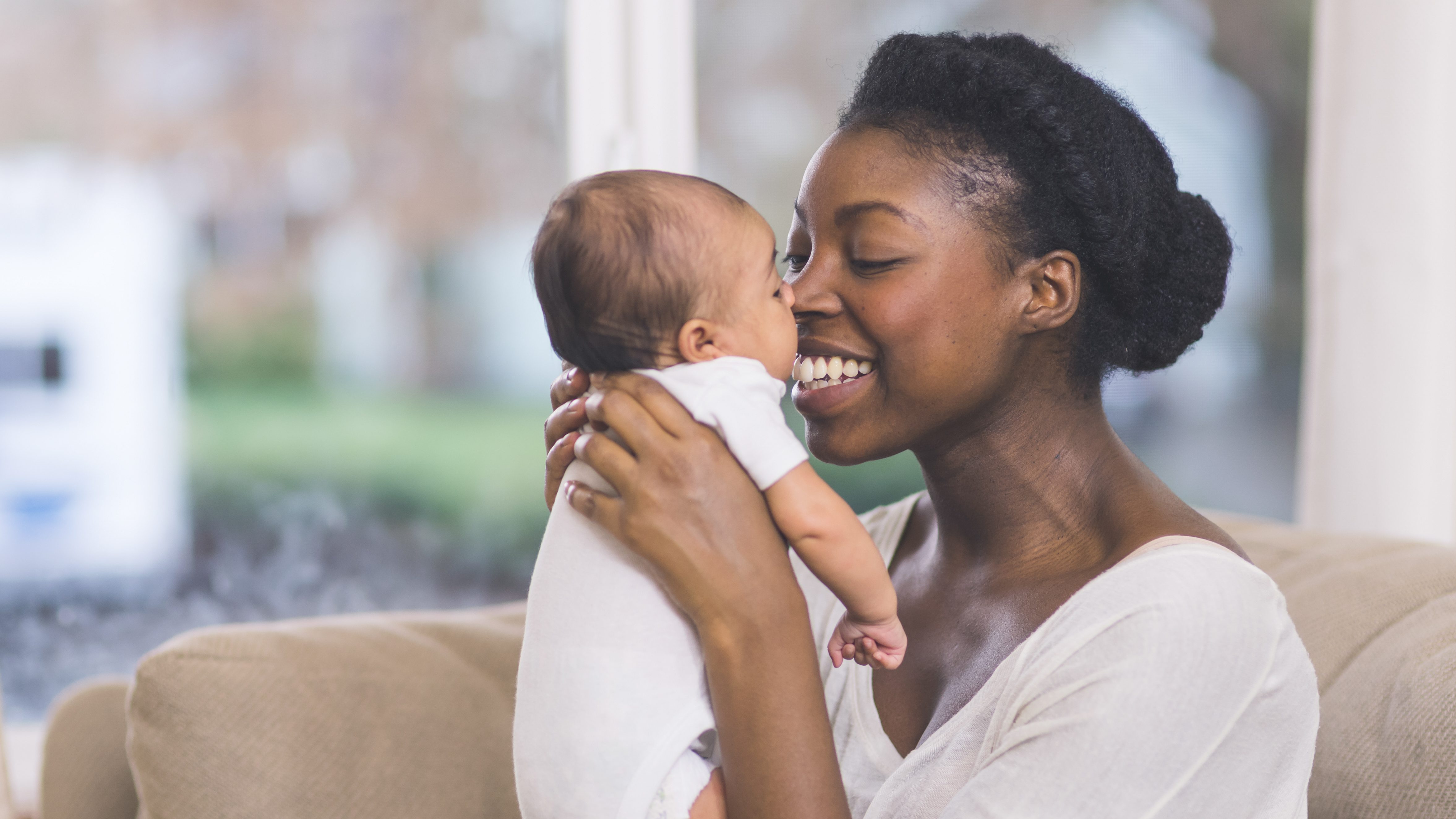 Mama holding her newborn baby