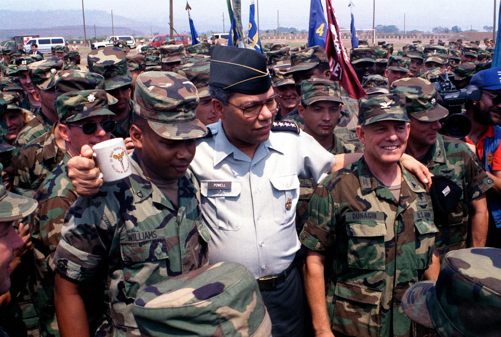GEN Colin Powell, chairman, Joint Chiefs of Staff, poses for a photograph with soldiers from Joint Task Force B. Powell is visiting Honduras as part of exercise Fuertes Caminos '91.