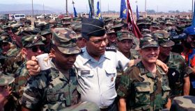 GEN Colin Powell, chairman, Joint Chiefs of Staff, poses for a photograph with soldiers from Joint Task Force B. Powell is visiting Honduras as part of exercise Fuertes Caminos '91.